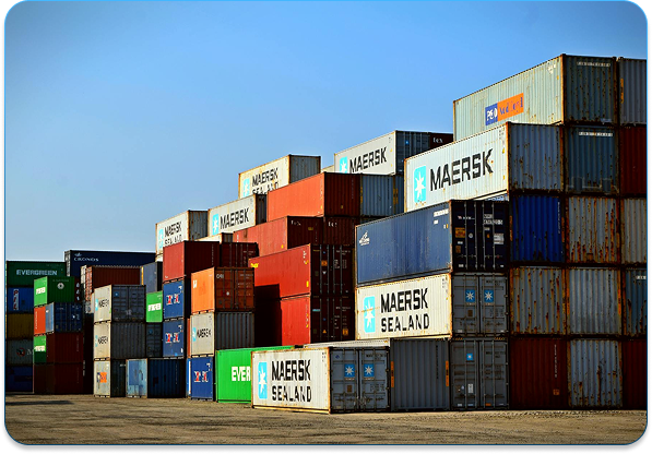 Logistics shipping containers stacked at a port facility