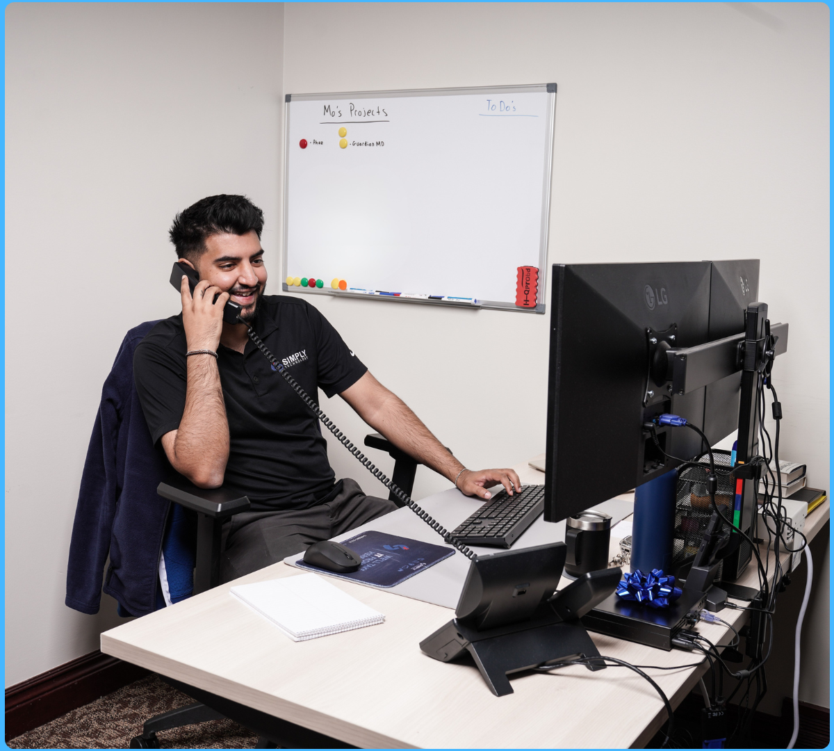 A Simply Technology technician on a support call at the Grosse Pointe Woods service desk