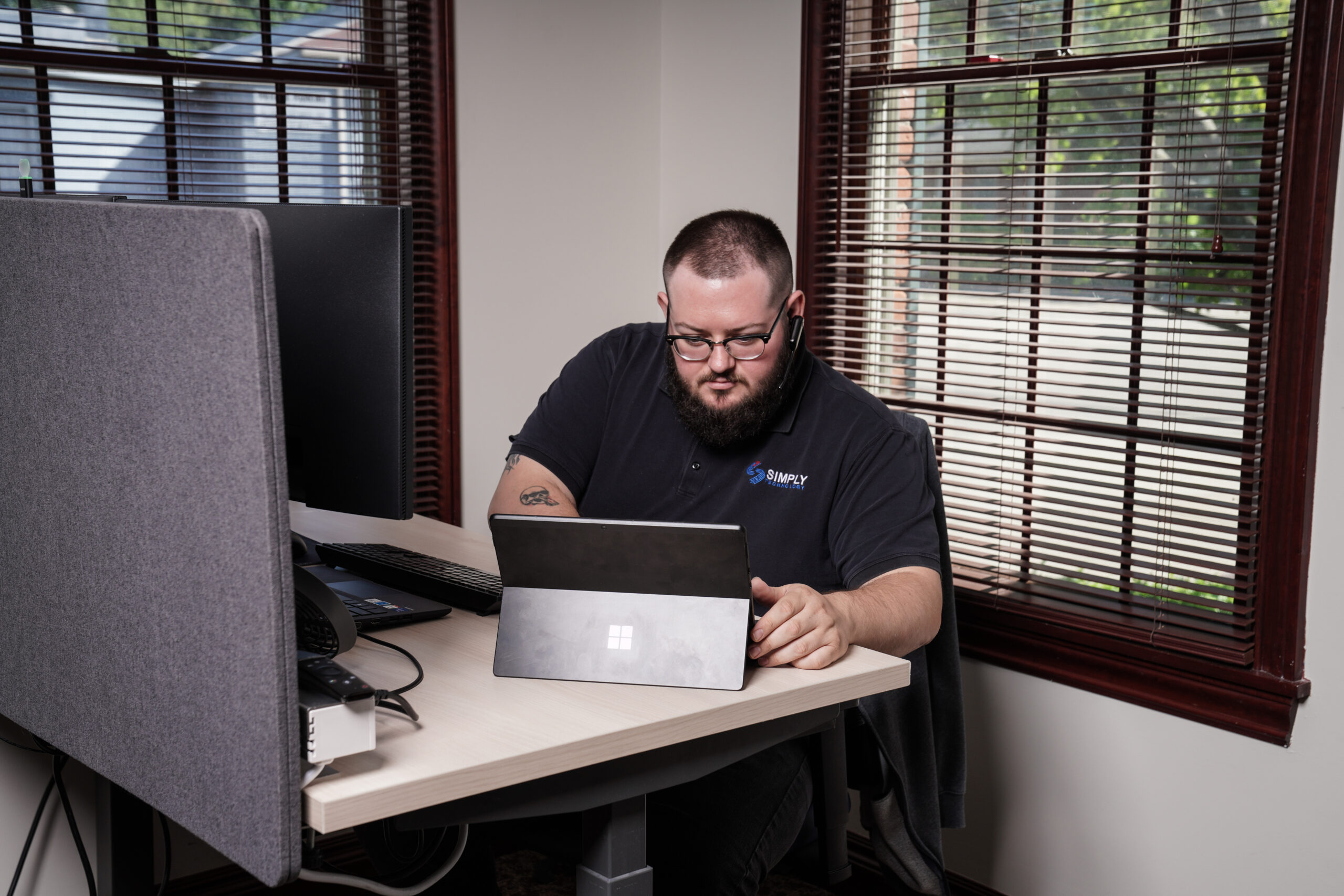 Simply Technology technician reviewing network performance for a Metro Detroit business