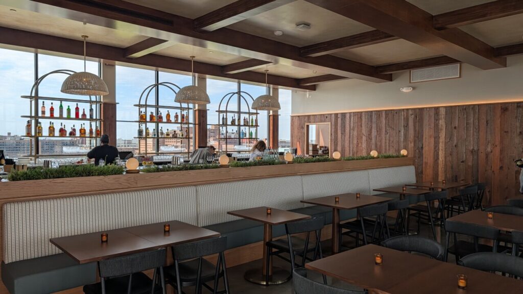 Topa Rooftop Bar interior with bar seating and Detroit skyline view